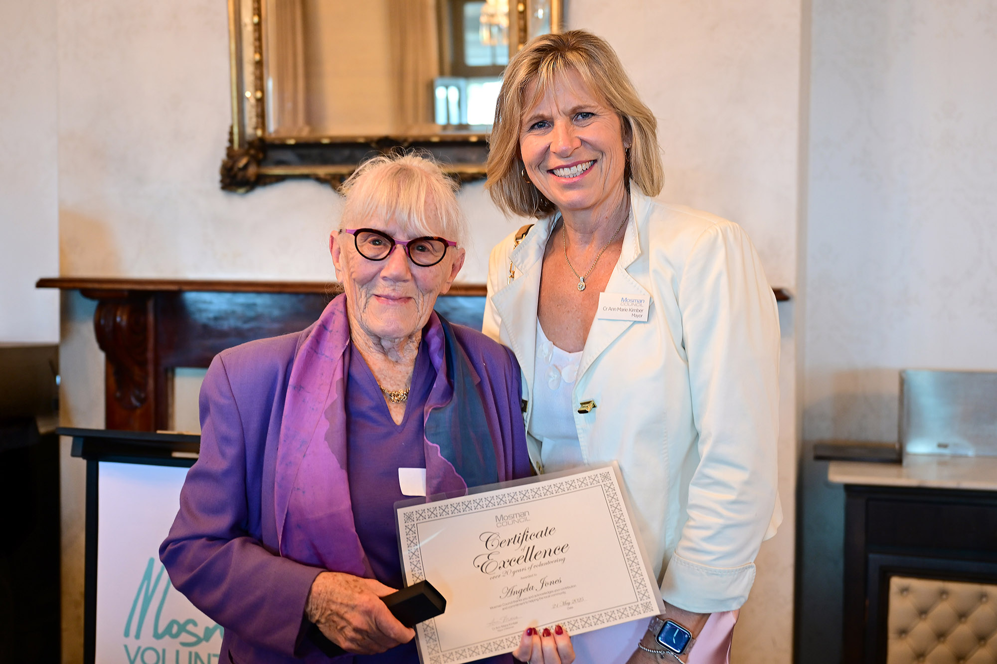Volunteer certificate recipient with Mayor